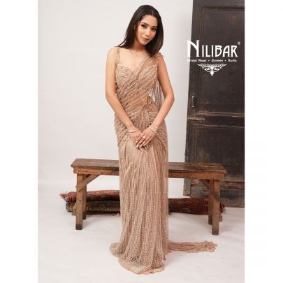 Beige Gold Heavy Embroidered Net Blouse Paired With Pleated Drape Saree