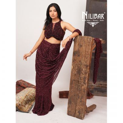 Burgundy Net Crop Blouse Paired With Pleated Drape Saree