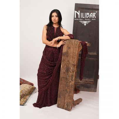 Burgundy Net Crop Blouse Paired With Pleated Drape Saree