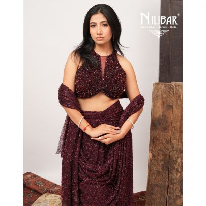 Burgundy Net Crop Blouse Paired With Pleated Drape Saree