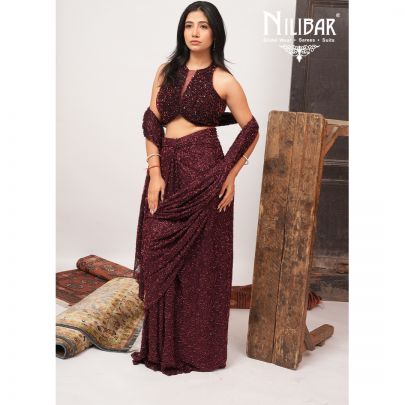 Burgundy Net Crop Blouse Paired With Pleated Drape Saree