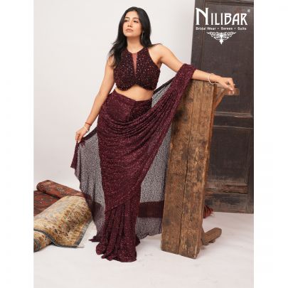 Burgundy Net Crop Blouse Paired With Pleated Drape Saree