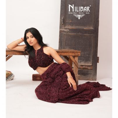 Burgundy Net Crop Blouse Paired With Pleated Drape Saree