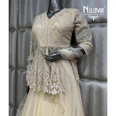 Ivory Organza Soft Net Peplum Top Paired with Lehenga & Dupatta