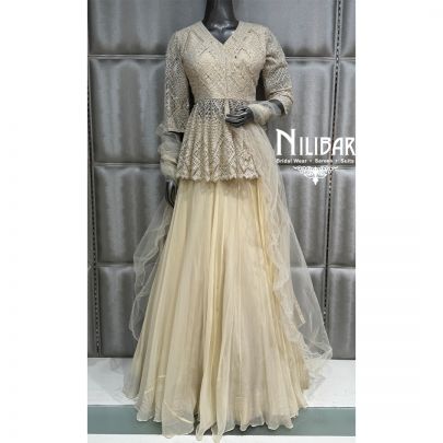 Ivory Organza Soft Net Peplum Top Paired with Lehenga & Dupatta