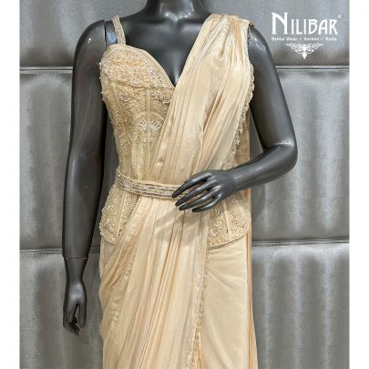 Cream Saree Paired With Net Blouse and Crepe Drape