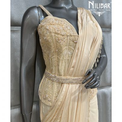 Cream Saree Paired With Net Blouse and Crepe Drape