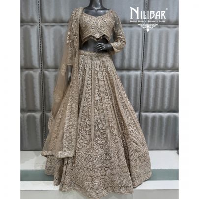 Ivory & Gold Embroidered Crop Top Paired With Lehenga & Soft Net Dupatta