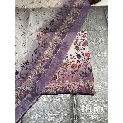 White and Purple Muslin Cotton Unstitched Suit embellished with floral print work along with muslin cotton foursided bordered dupatta.
