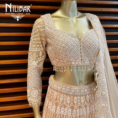 Peach Net Engagement Lehenga