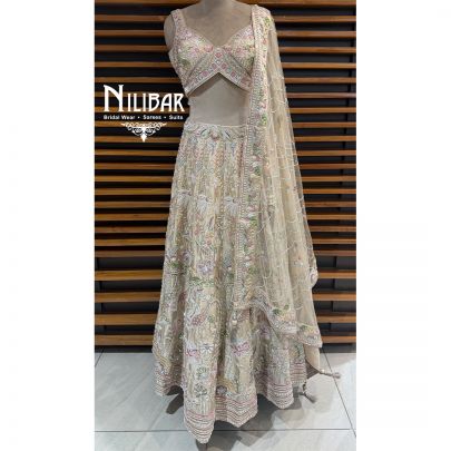 Ivory Silk Lehenga Choli Paired With Net Dupatta