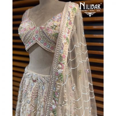 Ivory Silk Lehenga Choli Paired With Net Dupatta