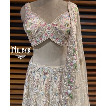 Ivory Silk Lehenga Choli Paired With Net Dupatta