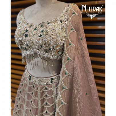 Copper Lame Silk Lehenga Choli Paired With Net Dupatta