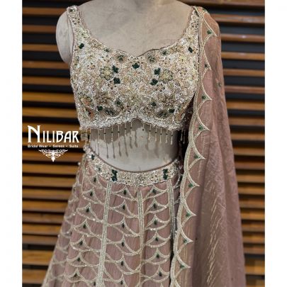 Copper Lame Silk Lehenga Choli Paired With Net Dupatta
