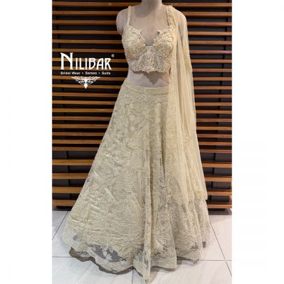Ivory Net Lehenga Choli Paired With Dupatta