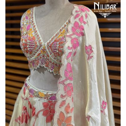 Ivory Lame Silk Lehenga Choli Paired With Net Dupatta