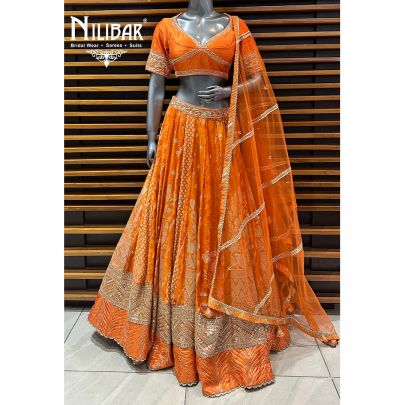 Orange Silk Blouse and Lehenga Paired With Net Dupatta