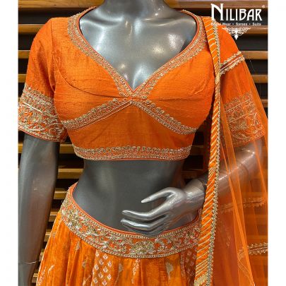 Orange Silk Blouse and Lehenga Paired With Net Dupatta