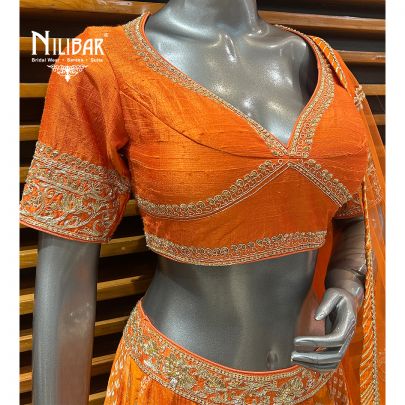 Orange Silk Blouse and Lehenga Paired With Net Dupatta