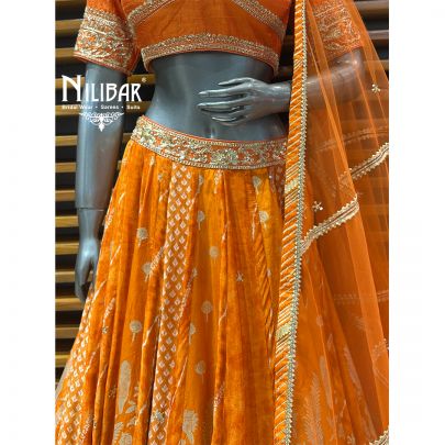 Orange Silk Blouse and Lehenga Paired With Net Dupatta