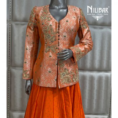 Orange Brocade Top Paired With Silk Skirt
