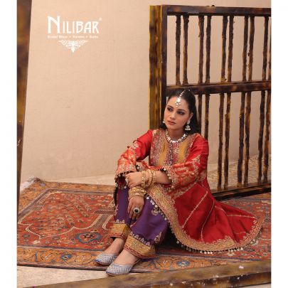 Orange Silk Shirt Paired With Purple Contrast Salwar & Net Dupatta