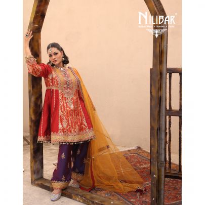 Orange Silk Shirt Paired With Purple Contrast Salwar & Net Dupatta