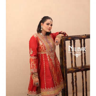 Orange Silk Shirt Paired With Purple Contrast Salwar & Net Dupatta