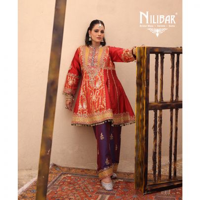 Orange Silk Shirt Paired With Purple Contrast Salwar & Net Dupatta