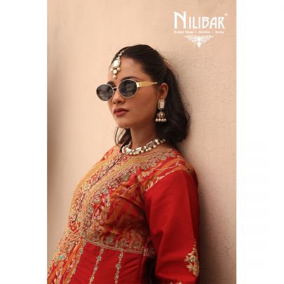 Orange Silk Shirt Paired With Purple Contrast Salwar & Net Dupatta