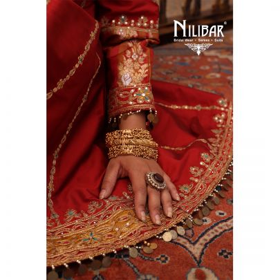 Orange Silk Shirt Paired With Purple Contrast Salwar & Net Dupatta