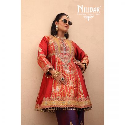 Orange Silk Shirt Paired With Purple Contrast Salwar & Net Dupatta