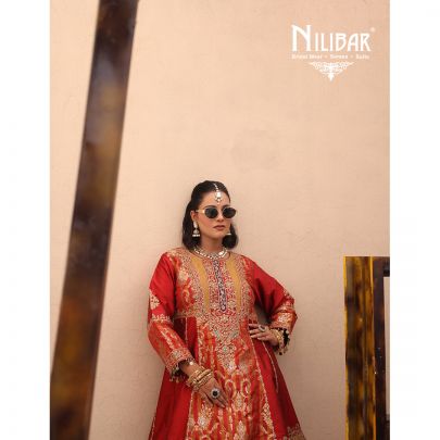 Orange Silk Shirt Paired With Purple Contrast Salwar & Net Dupatta