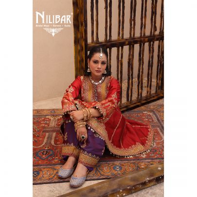 Orange Silk Shirt Paired With Purple Contrast Salwar & Net Dupatta