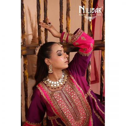 Purple & Pink Silk Shirt Paired With Purple Salwar & Pink Net Dupatta