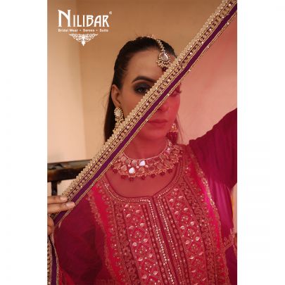 Purple & Pink Silk Shirt Paired With Purple Salwar & Pink Net Dupatta