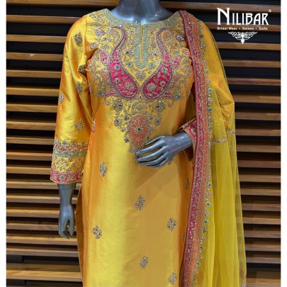 Yellow Silk A-Line Shirt Paired With Pants & Net Dupatta