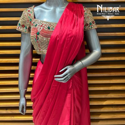 Red Silk Blouse Paired With Satin Drape Saree