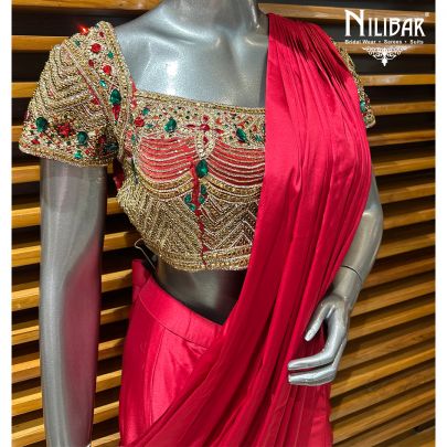Red Silk Blouse Paired With Satin Drape Saree