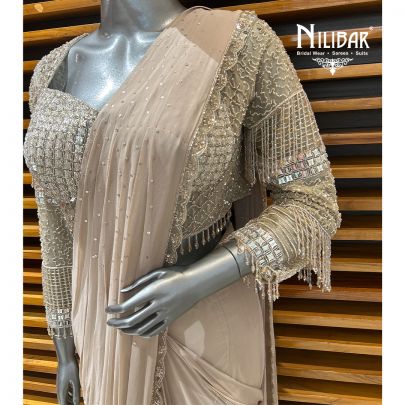 Pale Pink Net Blouse Paired With Georgette Drape Saree