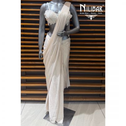 Ivory Gold Lycra Pre-Draped Saree Paired With Net Blouse