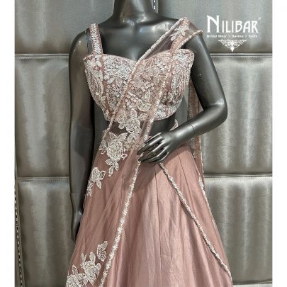 Ivory Gold Lycra Pre-Draped Saree Paired With Net Blouse