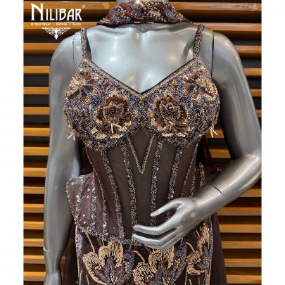 Coffee Net Lehenga Paired With Corset Top