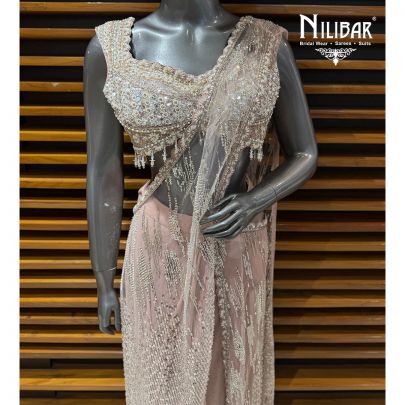 Baby Pink Net Heavy Embroidered Blouse Paired With Drape Saree