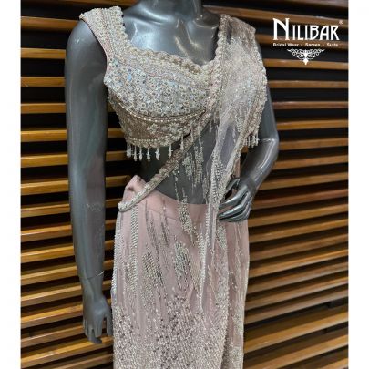 Baby Pink Net Heavy Embroidered Blouse Paired With Drape Saree