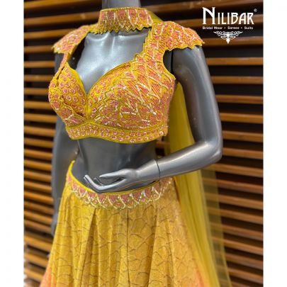 Yellow & Pink Georgette Crop Blouse Paired With Lehenga & Net Neck Dupatta
