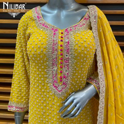 Yellow Georgette Garara Suit Paired With Organza Dupatta