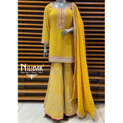 Yellow Georgette Garara Suit Paired With Organza Dupatta