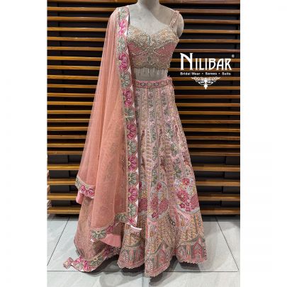Peach Silk Crop Choli Paired With Lehenga & Net Dupatta